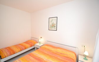 apartmánový dom Gemini s bazénom a záhradou v časti Pineda v Bibione, zájazdy autobusovou a ind. dopravou CK TURANCAR